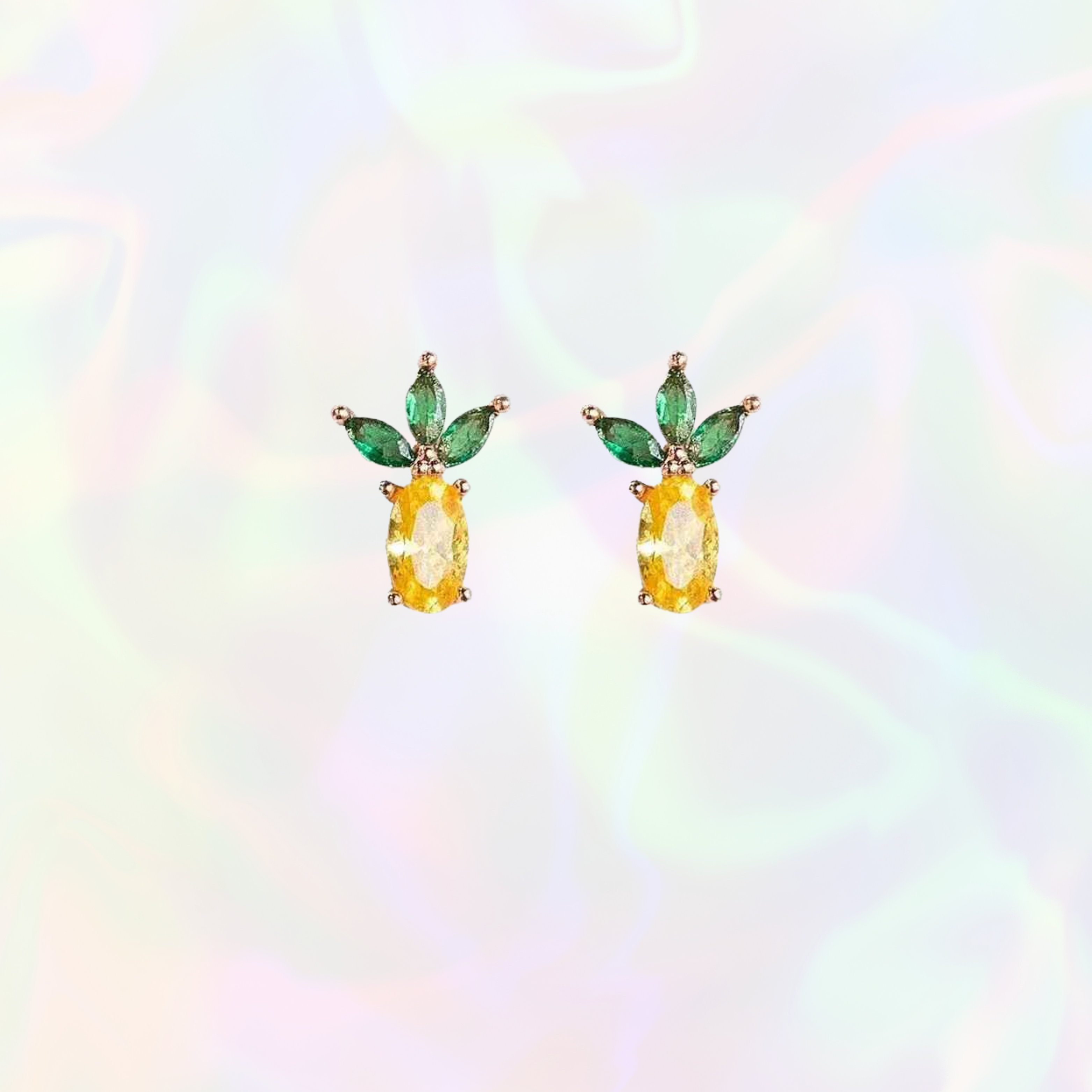 Pineapple-shaped earrings with green leaves on a multicolored background