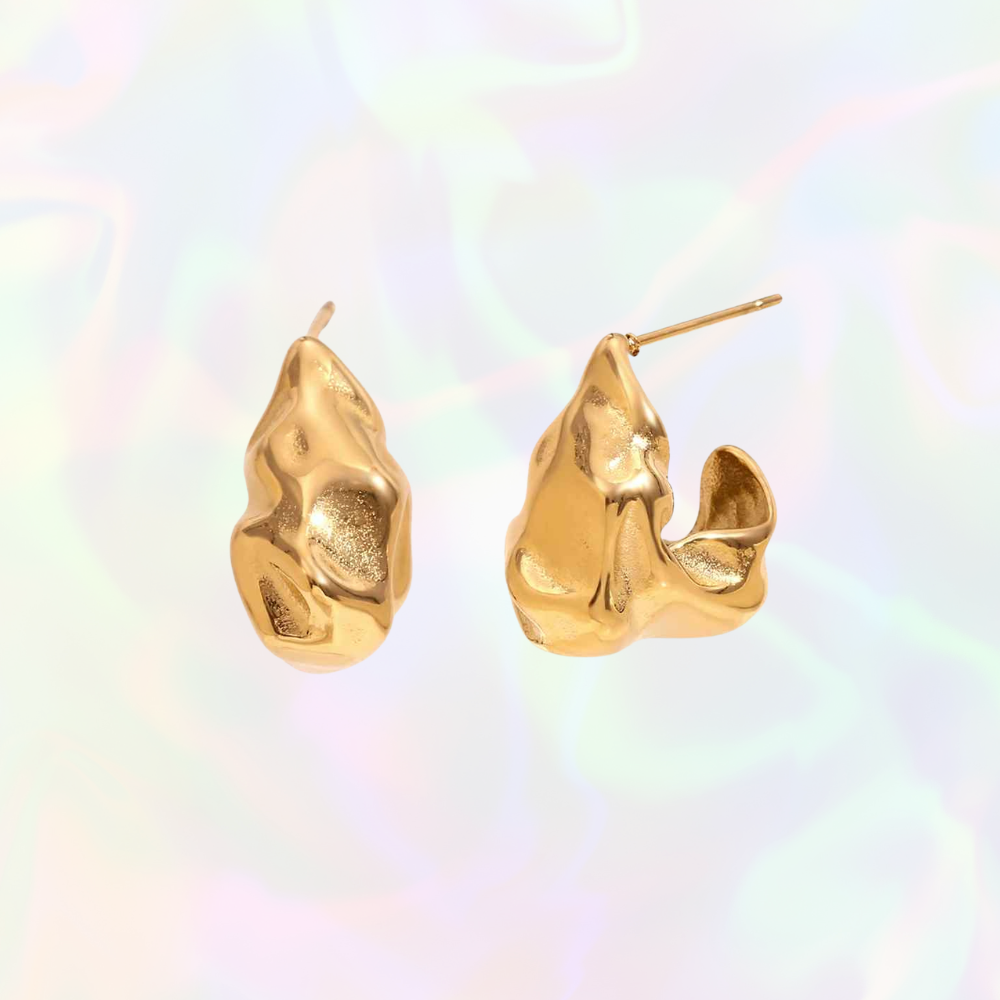 Gold waterproof hoop earrings on a multicolored background