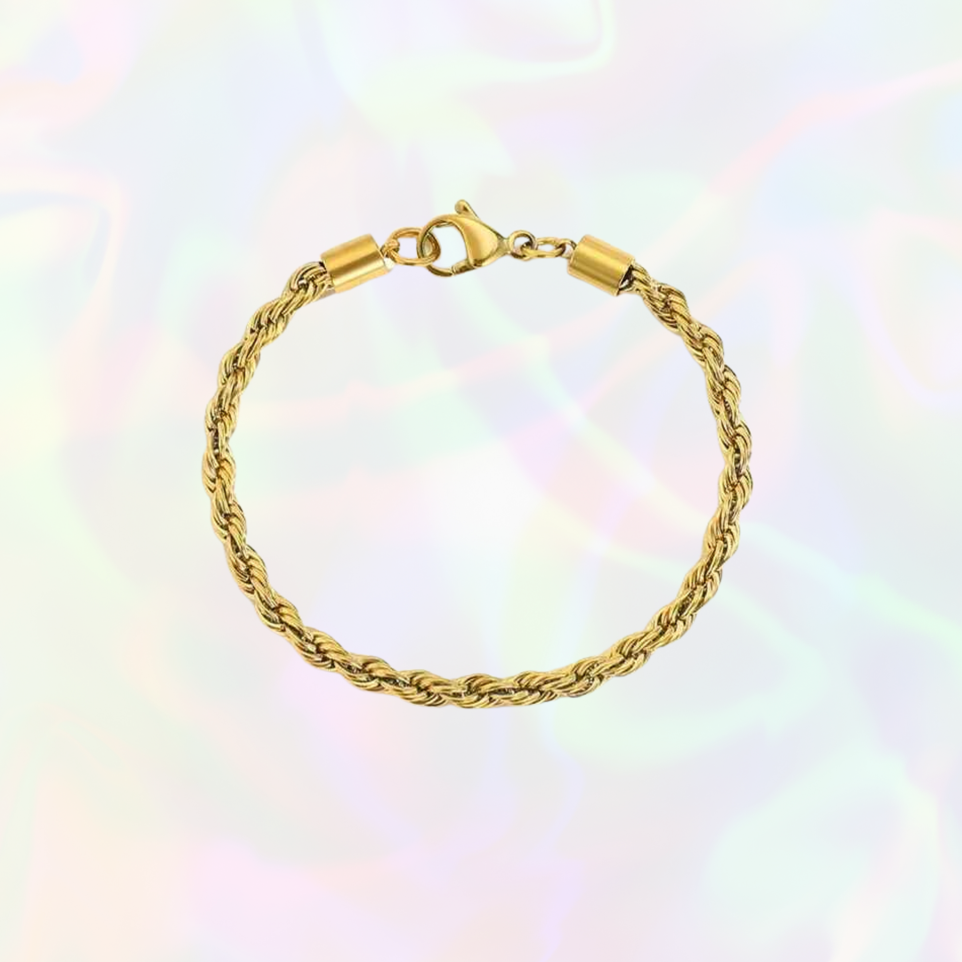 Gold braided bracelet on a colorful gradient background