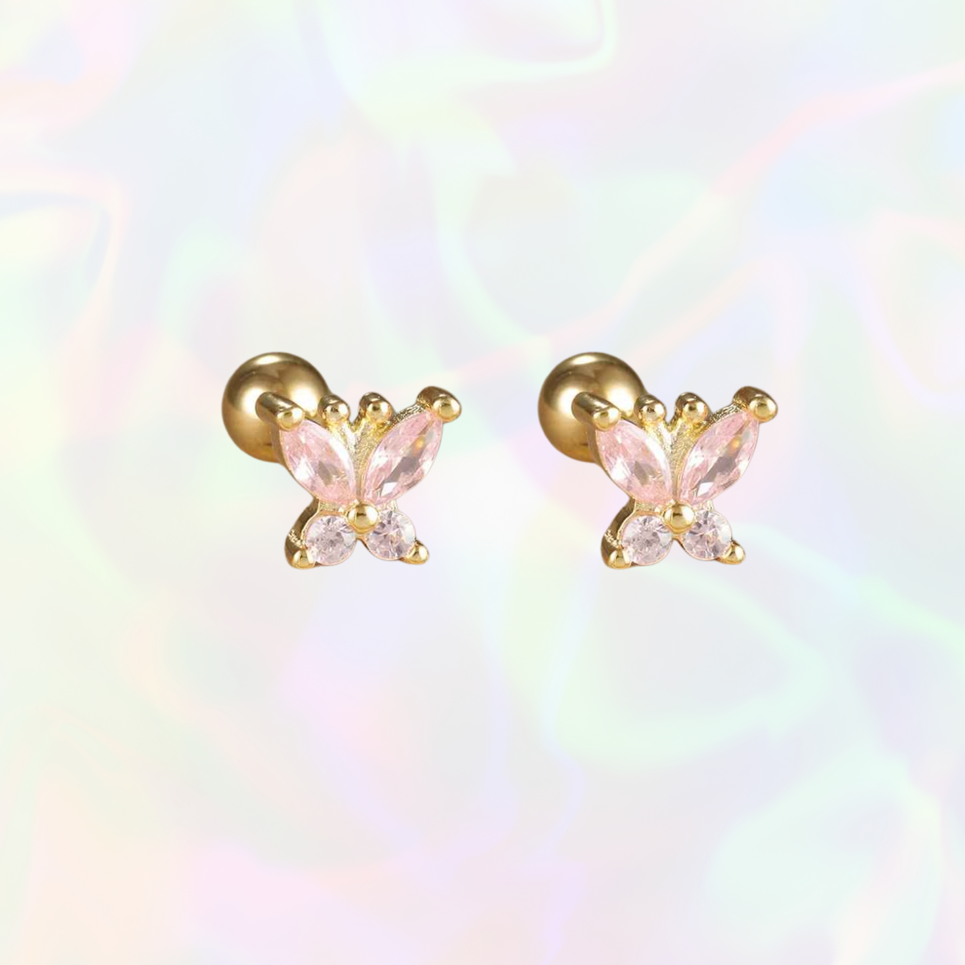 Butterfly-shaped stainless steel earrings with pink gemstones on a rainbow gradient background