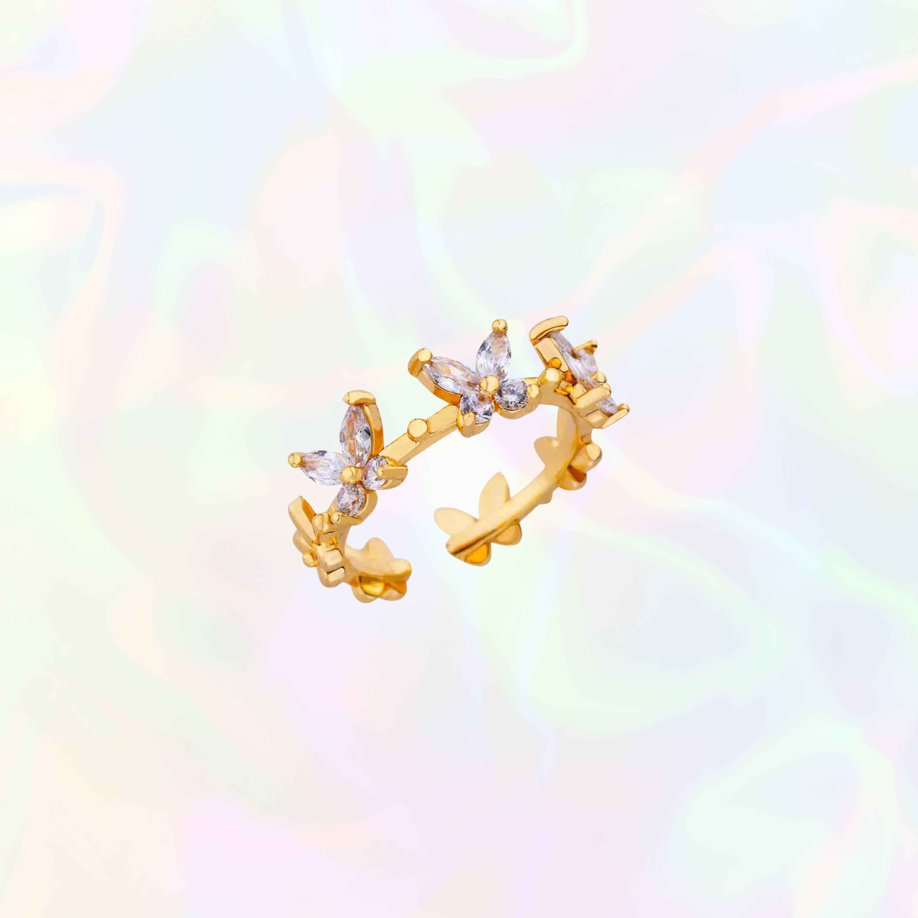 Gold butterfly-shaped earring on a colorful gradient background
